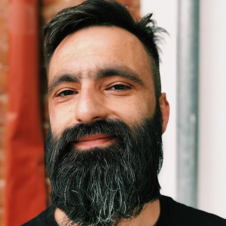 Kaveri Mehta, Lead Design Curator at Tide Cove Island, reviewing corporate floral arrangements